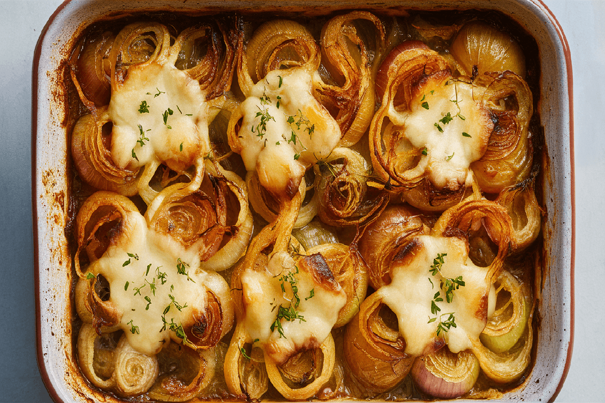 A baking dish of golden, cheesy Tennessee Onions fresh out of the oven