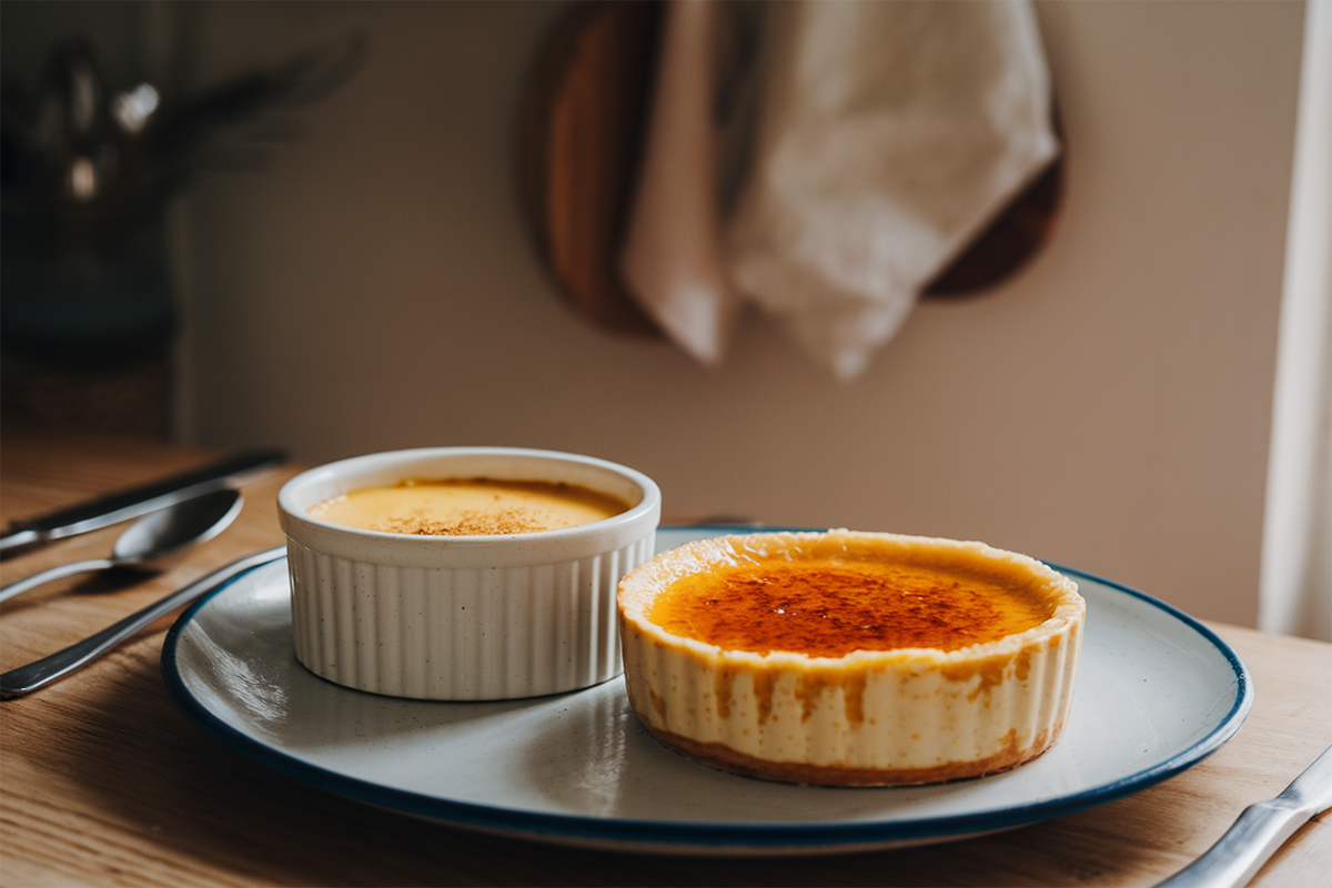 Close-up of baked custard and crème brûlée side by side